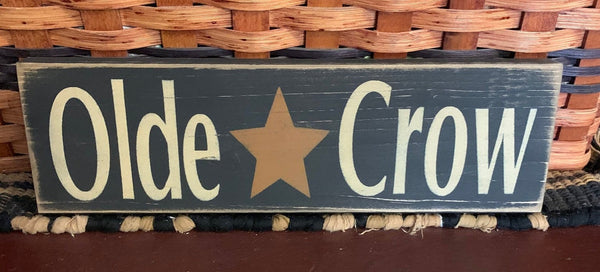 This sign is painted  black with antique white letters, then sanded and stained it for a prim look. It is routed in the back for easy hanging. This sign measures 12" x 3.5" x .75" and is made from pine wood which may have imperfections such as knots, raised grain or other markings. No two are exactly the same.