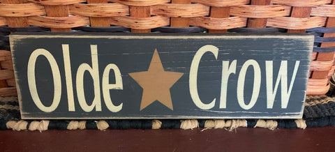 This sign is painted  black with antique white letters, then sanded and stained it for a prim look. It is routed in the back for easy hanging. This sign measures 12" x 3.5" x .75" and is made from pine wood which may have imperfections such as knots, raised grain or other markings. No two are exactly the same.
