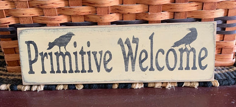 This sign is painted antique white over black with black lettering and is sanded and stained for a primitive look. It is routed in the back for easy hanging. This sign measures 12" x 3.5" x .75" and is made from pine wood which may have imperfections such as knots, raised grain or other markings. No two are exactly the same.