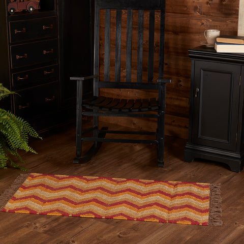 Sierra Kilim Rug Rect 24x48 - Final Qty - ClearanceChevron stripes of fresh red, sunny yellow, with white accents give the Sierra Kilim Rug a colorful, rustic personality. The ancient process of tapestry weaving provides a timelessness yet striking design at the same time. The tassels complement the look. This rug is the perfect addition to any farmhouse decor.