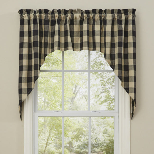 These lovely Wicklow Black Swags provide the perfect window treatment for any country home! Sporting a warm tan & black traditional check pattern, this unassuming design is both pretty and practical! They come unlined to allow soft light to filter through! Perfect on their own, or pair with coordinating tiers for a more dramatic appeal! 