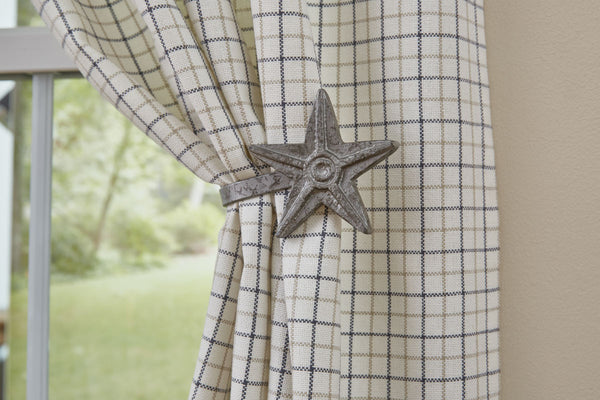 A wonderful accent item to highlight your panel curtains. The Star Curtain Tieback by has a galvanized finish and will look great in a country far