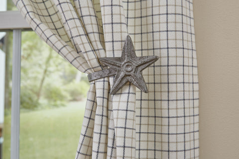 A wonderful accent item to highlight your panel curtains. The Star Curtain Tieback by has a galvanized finish and will look great in a country far