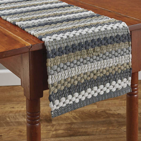 Create a warm and inviting table with the Hartwick Chindi Table Runner.  The colors of gunmetal, dove gray, tan and candlelight white make for a stylish farmhouse look and gives your table top a great textured look!