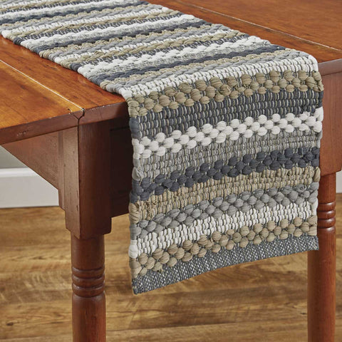 Create a warm and inviting table with the Hartwick Chindi Table Runner.  The colors of gunmetal, dove gray, tan and candlelight white make for a stylish farmhouse look and gives your table top a great textured look!