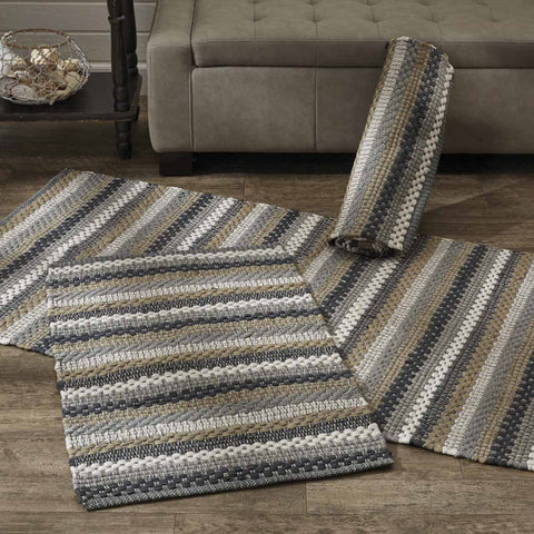 Add a touch of color and texture to your room with the Hartwick Rag Rug. The colors of gunmetal, dove gray, tan and white make for stylish farmhouse charm.  Colors: Gunmetal, Dove Gray, Tan & Candlelight Wh