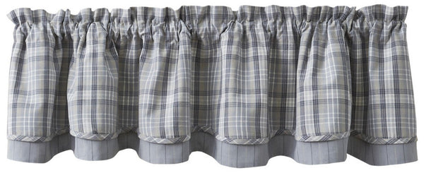 Create a warm and inviting look to your room with the Hartwick Lined Layered Valance. The colors of gunmetal, dove gray, tan and candlelight white make for stylish farmhouse charm! 