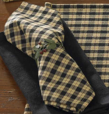 Add country class to your dining decor with these Star Patch Decorative Place Napkins! Featuring a pretty plaid in black & sand, they blend beautifully with various home designs! Charming!  Colors: Black, Sand & Cranberry