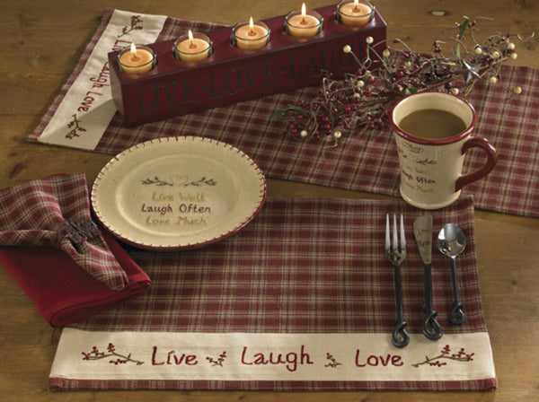 The Sturbridge "Live, Laugh, Love" Placemats offer a pleasing wine & farmhouse tan homespun checked pattern while the border proclaims a gentle reminder to Live, Laugh, Love! A perfect way to enhance your dining experience...or, use throughout your home as a candle mat, under a lamp, on your mantel...let your imagination run wild! 