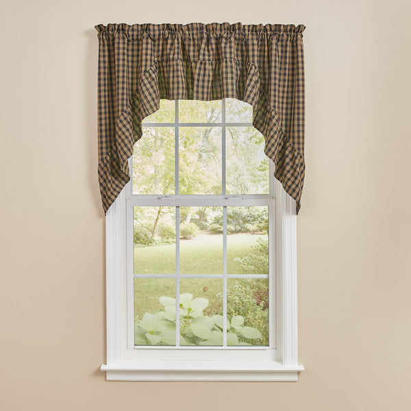 Add a gorgeous country accent to your window with the Sturbridge Plaid Black Ruffle Swags ! The gorgeous plaid pattern in black and farmhouse tan gives classic style! The ruffles are the perfect finishing touch! Pair with a tier (as shown/ not included) for dramatic appeal.  Colors: Black & Farmhouse Tan