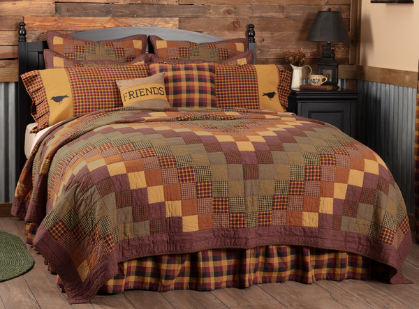 The Heritage Farms California King Quilt is decorated with cascading blocks of various crimsons, mustards, and black for a visually mesmerizing and enticing look. The cascading blocks are then beautifully framed by thick channel bordering. Primitive Country Farmhouse Quilted Bedding