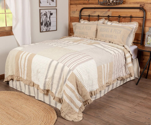 Grace King Quilt 105Wx95L, enlarged ticking stripes, a farmhouse staple, are spaced among checks and windowpanes and encompassed with a ruffled burlap border. Primitive Country Farmhouse Bedding Home Decor.