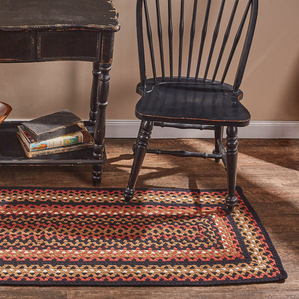 Folk Art Braided Rectangle Rug 2x6' features rich shades of Barn Red, Black, Khaki Tan & Ivory, reminiscent of vintage design.  Colors: Barn Red, Black, Khaki Tan & Ivory
