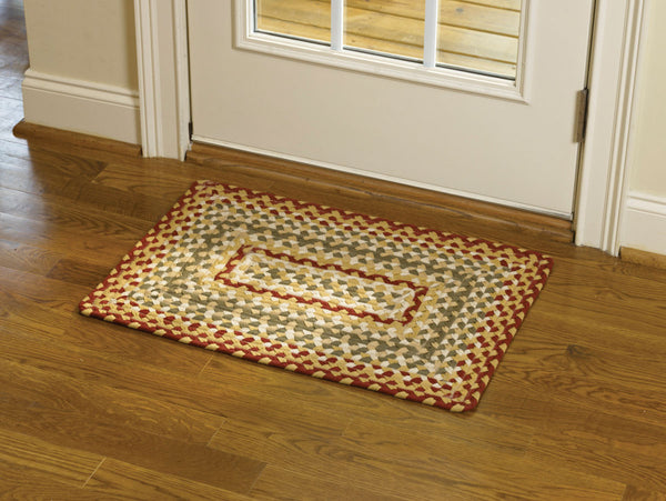 The Mill Village Braided Rug 20x30 feature a vibrant garnet, combines it with green and cream, then softens it with buttercream to make these lovely rugs!