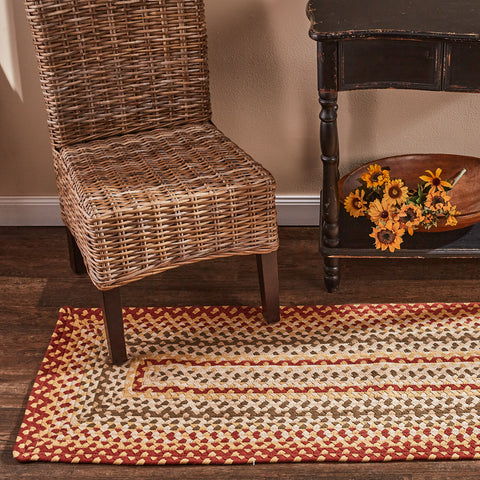 The Mill Village Braided Rug 2x6  feature a vibrant garnet, combines it with green and cream, then softens it with buttercream to make these lovely rugs!