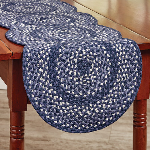 Bluestone Cotton Scalloped Braided Table Runner 54" L  This accent rug measures 15" x 54" and is perfect for adding a pop of color in any room in the home