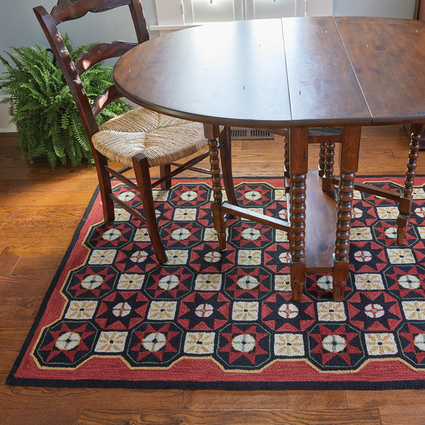 The Folk Star Rug is a charming hand-crafted hooked rug. 
