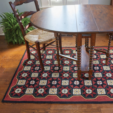 The Folk Star Rug is a charming hand-crafted hooked rug. 
