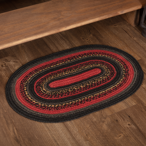 Cumberland Jute Rug Oval 20x30, concentric circles of chili pepper red, caviar black, and natural tan, Primitive Country Farmhouse Log Cabin Rustic Wood Cutters, Home Decor.