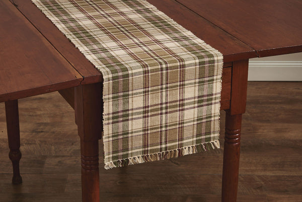 This Thyme Table Runner is a beautiful addition to any decor! It offers soft tones of green, red & tan that blend perfectly together to create a pretty plaid that oozes warm, country ambiance in your dining area! So versatile, use throughout your home as an accent mat for your favorite candle/decorative pieces, under a lamp, on a mantel, or wherever your creativity leads you!
