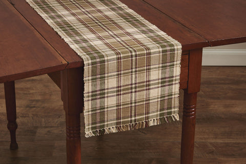 This Thyme Table Runner is a beautiful addition to any decor! It offers soft tones of green, red & tan that blend perfectly together to create a pretty plaid that oozes warm, country ambiance in your dining area! So versatile, use throughout your home as an accent mat for your favorite candle/decorative pieces, under a lamp, on a mantel, or wherever your creativity leads you!