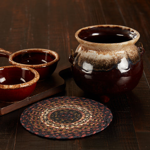 Beckham Jute Round Trivet, 8 inch rustic table trivet is the perfect feature to stop heat from hot pots and pans from destroying a valued table or countertop. Woven braided jute wool blend fabrics in brick red, dark tan, and country black and white in concentric circles. Visit website for FREE s/h & discount offers.