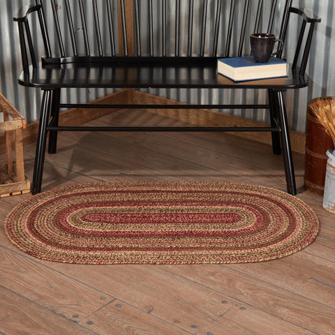 Cider Mill Jute Rug Oval. Featuring concentric, mixed braids of burgundy, tan, black, and olive green for a classic country, primitive look. Visit website for FREE s/h & discount offers.