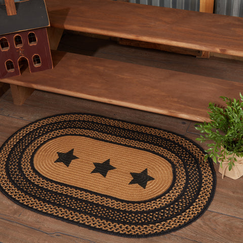 The 24"x36" Farmhouse Jute Oval Rug w/ Stencil Stars is ready for your home, retreat, or cabin with its durable and beautiful construction. Featuring alternating braids in black and dark tan with center stenciled 5-point stars. Visit website for FREE s/h & discount offers. Primitive Country Farmhouse Home Decor.