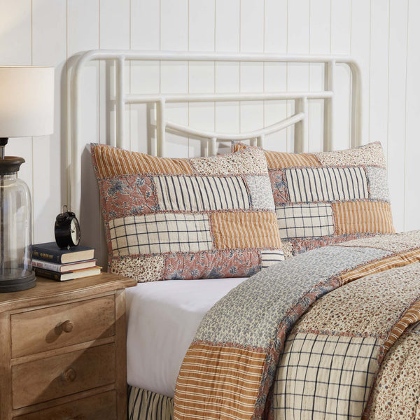 Adorn your vintage farmhouse bedroom with unique patterns and heirloom quality. The Kaila Standard Sham 21x27 mirrors our Kaila Quilt perfectly, showcasing delicate floral prints, classic stripes, and windowpane patterns in navy, gold, and dusty rose. Visit website for FREE s/h & discount offers.
