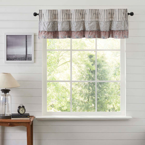 Kaila Blue Ruffled Valance 16x60. This navy and creme stripe curtain is beautifully decorated with graceful floral print ruffles towards the top that add rustic romance and heartwarming, cozy cottage vibes. Visit website for FREE s/h & discount offers.