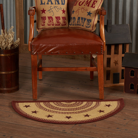 Burgundy and tan braided jute half-circle rug with stenciled stars in a primitive farmhouse entry.