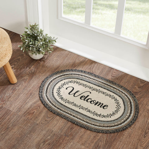 Floral Vine Rugs, 20 x 30 in. Rugs Features a blend of black, grey, and cream with a vine and floral design looping around the word, welcome for a soft, shabby chic look that complements a wide array of country farmhouse decor.