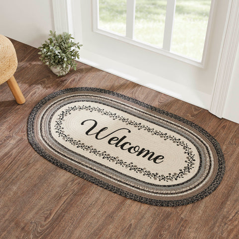 Floral Vine Rugs, 27 x 48 in. Rugs  Features a blend of black, grey, and cream with a vine and floral design looping around the word, welcome for a soft, shabby chic look that complements a wide array of country farmhouse decor.