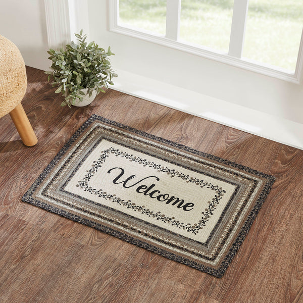 Floral Vine Rugs, 20 x 30 in. Rugs Features a blend of black, grey, and cream with a vine and floral design looping around the word, welcome for a soft, shabby chic look that complements a wide array of country farmhouse decor.
