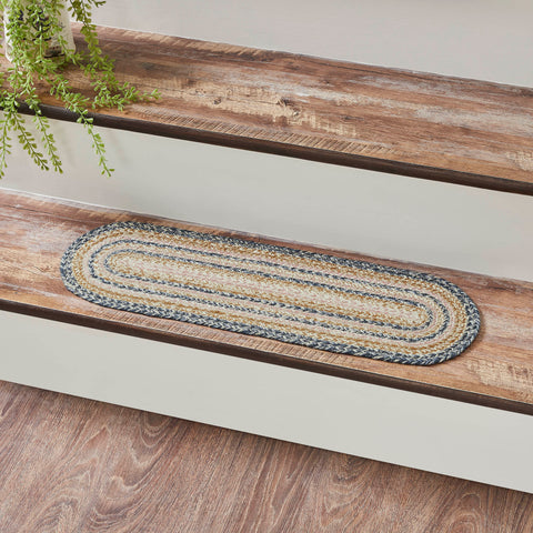 Kaila Jute Rugs, features a blend of blue, misty rose and golden tan braids for a cheerful, country boho look. 