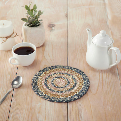 Kaila Jute Rugs  The Kaila Jute Trivet includes an individual circular trivet with a 8-inch diameter made from a premium Jute blend. The rich texture of braided jute is given a modern twist with dusk blue, misty rose and soft tan colors for a casual country boho style.