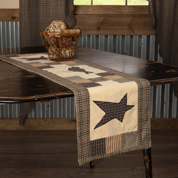 Kettle Grove Runner Crow and Star 13x48, Featuring assorted patchwork blocks in black, tan, charcoal and creme. A black and tan microcheck crow is proudly displayed in the center, Primitive Country Farmhouse Table Dining Kitchen Home Decor.