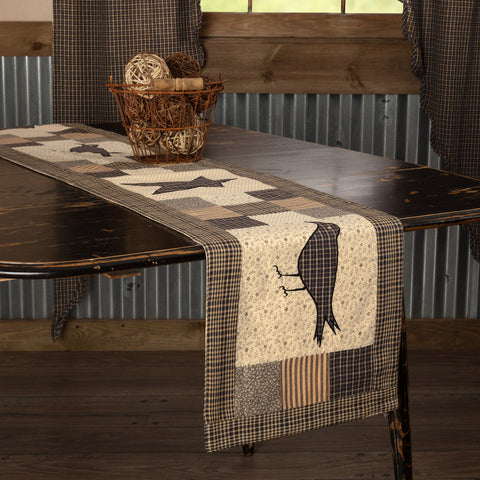 Kettle Grove Runner Crow and Star 13x72, Featuring assorted patchwork blocks in black, tan, charcoal and creme. A black and tan microcheck crow is proudly displayed in the center. Primitive Country Farmhouse Kitchen Table Dining Home Decor.