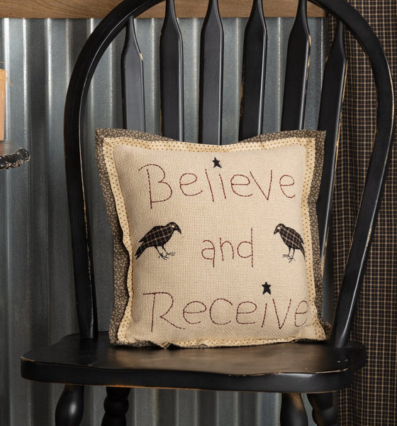 Primitive country farmhouse 12×12 pillow with burgundy “Believe & Receive” and plaid crows on tan cotton.