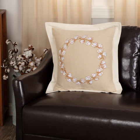 Ashmont Cotton Wreath Pillow 18x18 features an embroidered cotton wreach on khaki fabric.