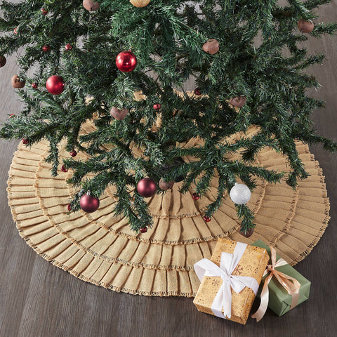 Yuletide Burlap Tan Ruffled Tree Skirt 36 Add timeless style to your Christmas traditions with the Yuletide Burlap Ruffled Tan Tree Skirt. The round tree skirt features a 36 inch diameter. A ruffled tan base in traditional cotton burlap will add warm, elegant style for a perfect farmhouse Christmas look