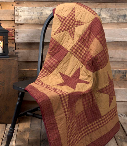 The Ninepatch Star Quilted Throw features a 3x4 grid of alternating plaid stars and ninepatch blocks. These classic primitive designs are bordered by rectangular frames of the Ninepatch patterns Burgundy Tan Primitive country farmhouse home decor blankets