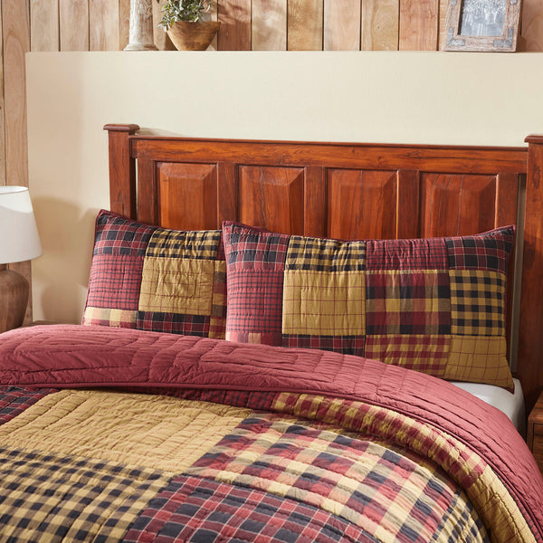 Connell King Sham 21x37 in burgundy, black, and natural patchwork. Hand-quilted 100% cotton cover adds rustic primitive charm to king-size pillows.