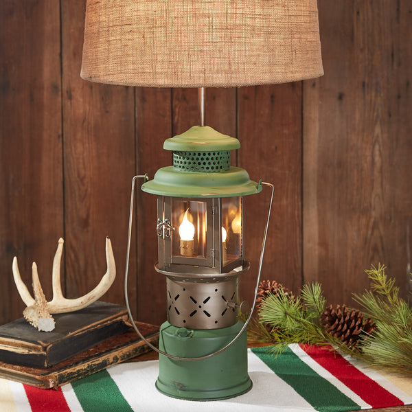 Add a rustic touch to any room with the Green Camp Lantern Lamp With Shade, featuring a lantern base, this lamp is a great addition to your farmhouse or lodge decor! So country charming!