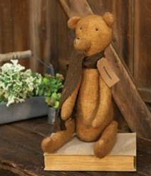 Brewster Bear is a stuffed bear perfect for any time of year! He has flexible limbs and a weighted bottom for easy display on any flat surface. Measures 13" high when seated (19" high overall) and 5" wide. Primitive Country Farmhouse Vintage Home Decor Accessories.