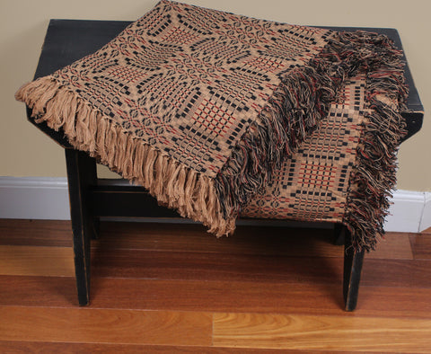 Shop the Trenton Jacquard Afghan – a 50x60 cotton throw with fringe, woven in black, barn red, and nutmeg tones. Perfect for primitive, colonial, or farmhouse-style décor. Machine washable.