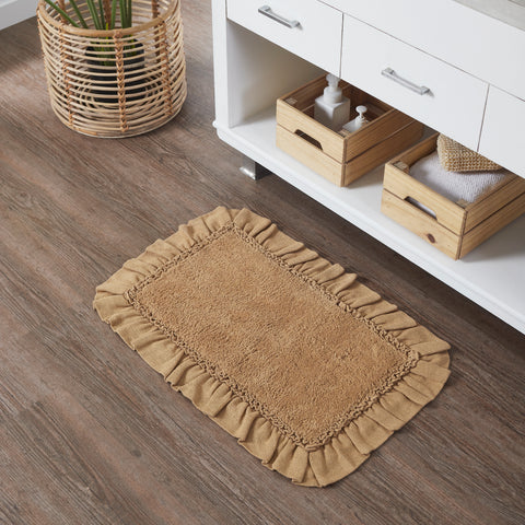 The Burlap Natural Bath Mat 20x30 adds primitive farmhouse charm with soft cotton, ruffled edges, and slip-resistant backing. Easy care, timeless style.