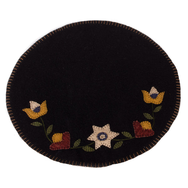 Our Black Flowering Vine Candle Mat is made of Wool-Felt. Size is 15 Inch diameter..