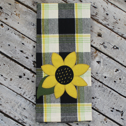 Our Sunflower Buffalo Check Towel (set of 2) features an applique sunflower on a plaid buffalo check cotton background.  Colors of Black, Buttermilk, Yellow and Greens