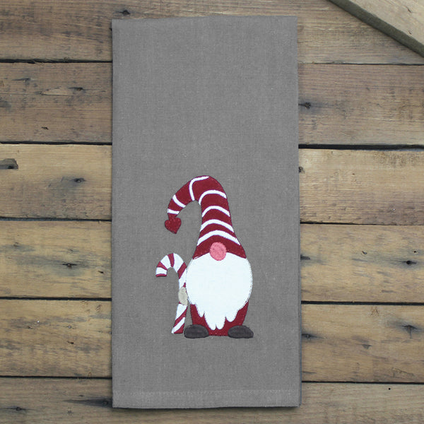 Holiday Gnomes Gray Towel features a gray background a an adorable gnome holding a candycane.
